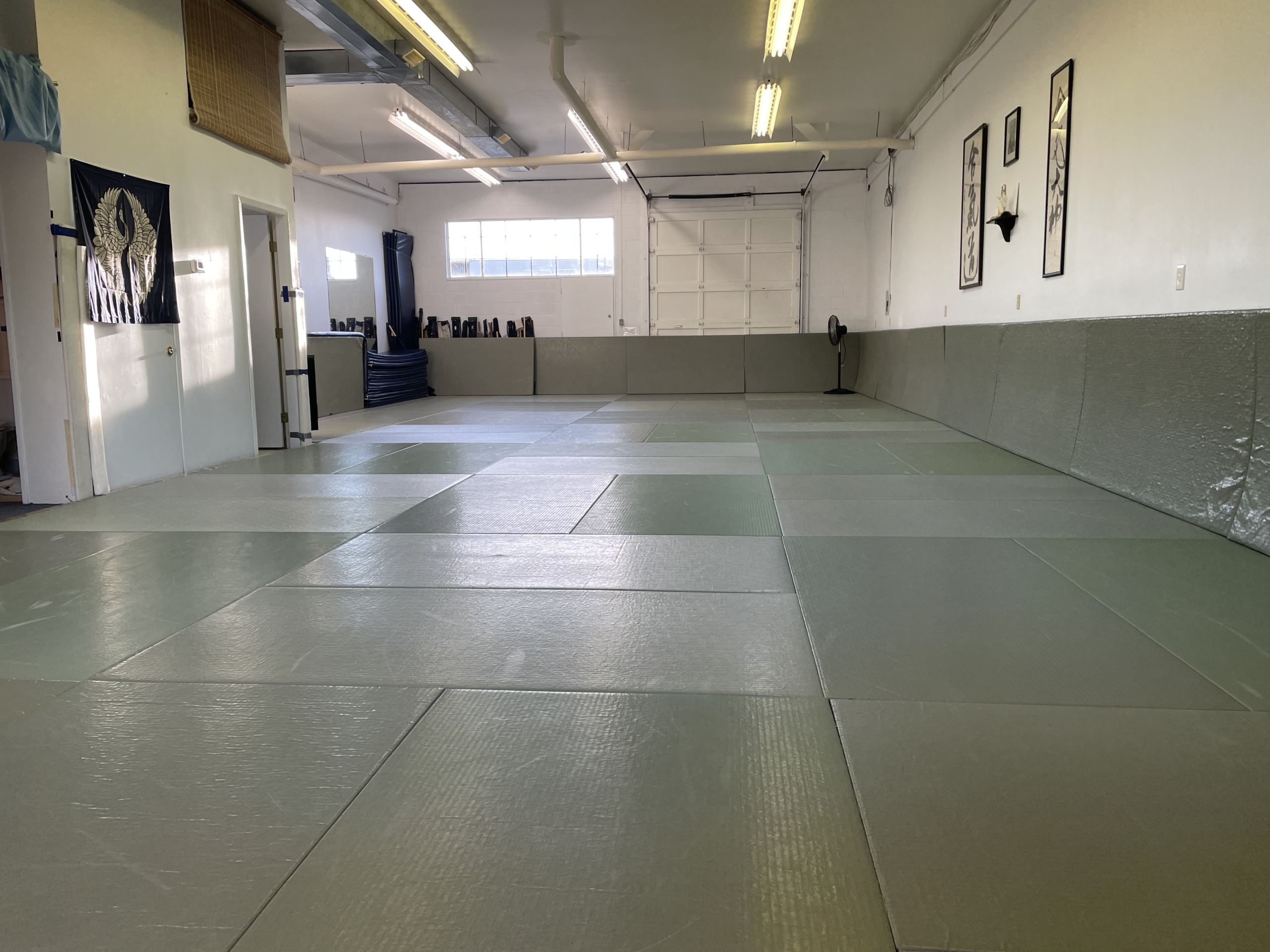 Main training area with natural light streaming through large windows